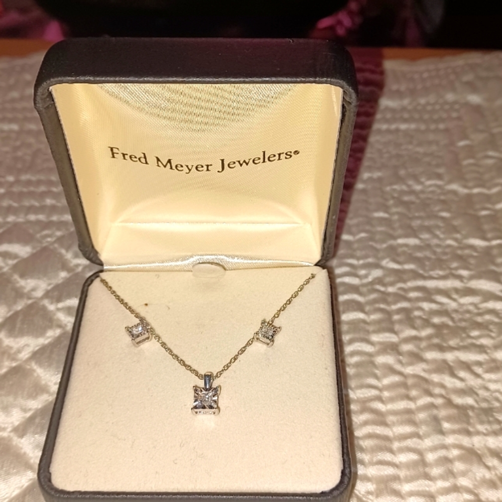 Fred Meyer* diamond necklace and earrings set.